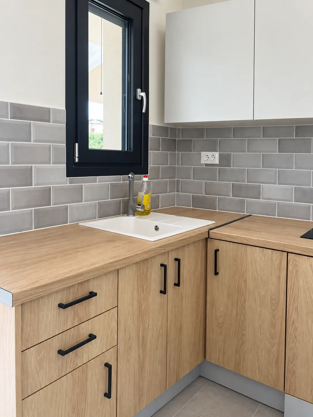 Kitchen worktop, sink and custom cabinet detail